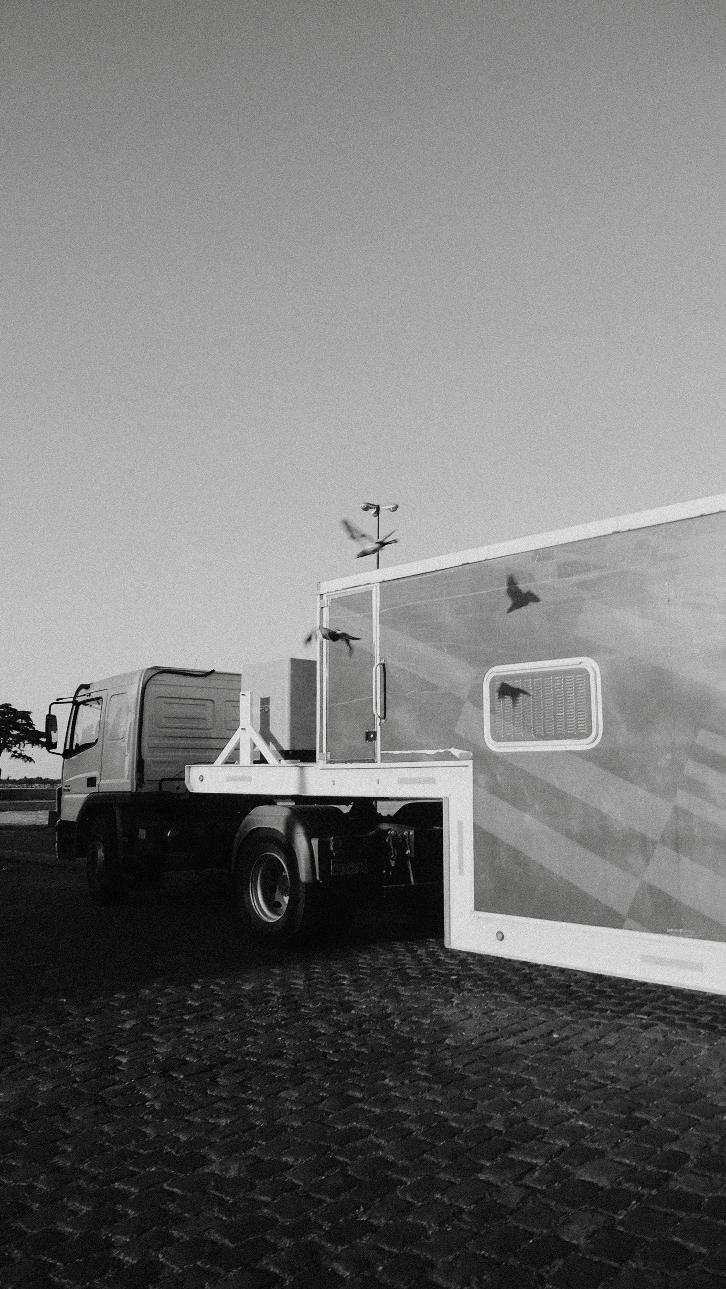 Surveillance trailer securing oilfield site with fencing and cameras